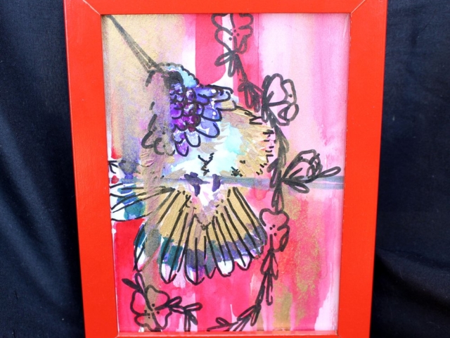 Mixed media on watercolor paper depicting a hummingbird and strand of tiny flowers in rosey pink with lavender and gold splashes.